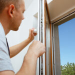 Worker Installing Checking Window House 150x150
